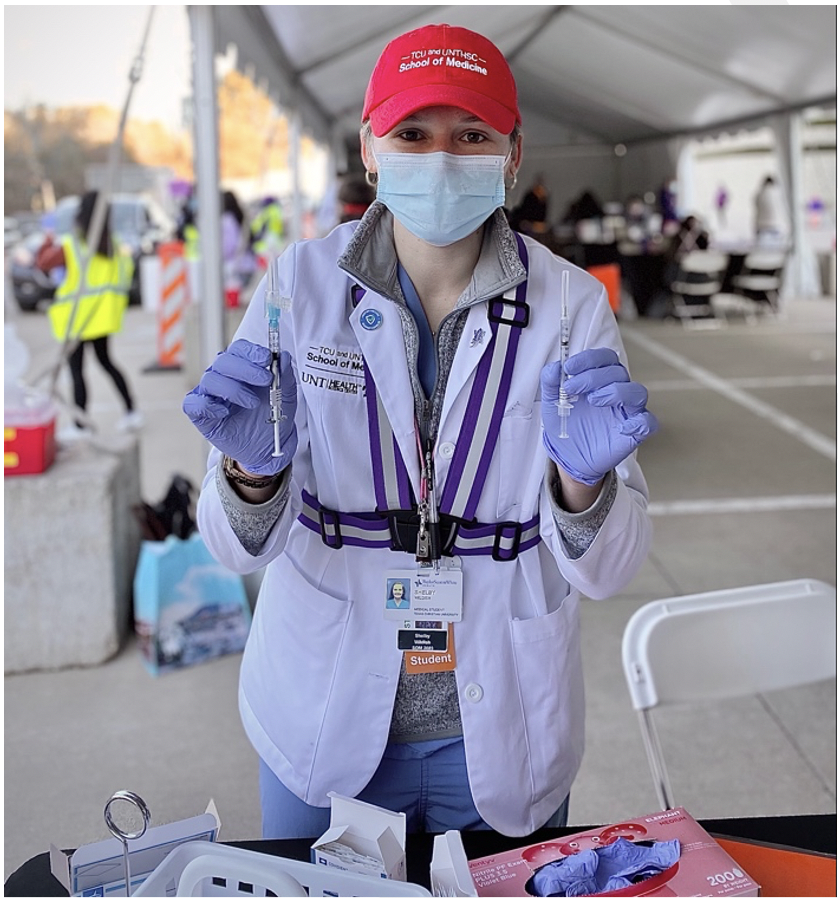 Shelby WIldish, a second-year medical student at TCU and UNTHSC School of Medicine helps prep her COVID-19 Vaccination station at the TCU/Baylor, Scott & White drive through vaccination site on Saturday, March, 6, 2021.