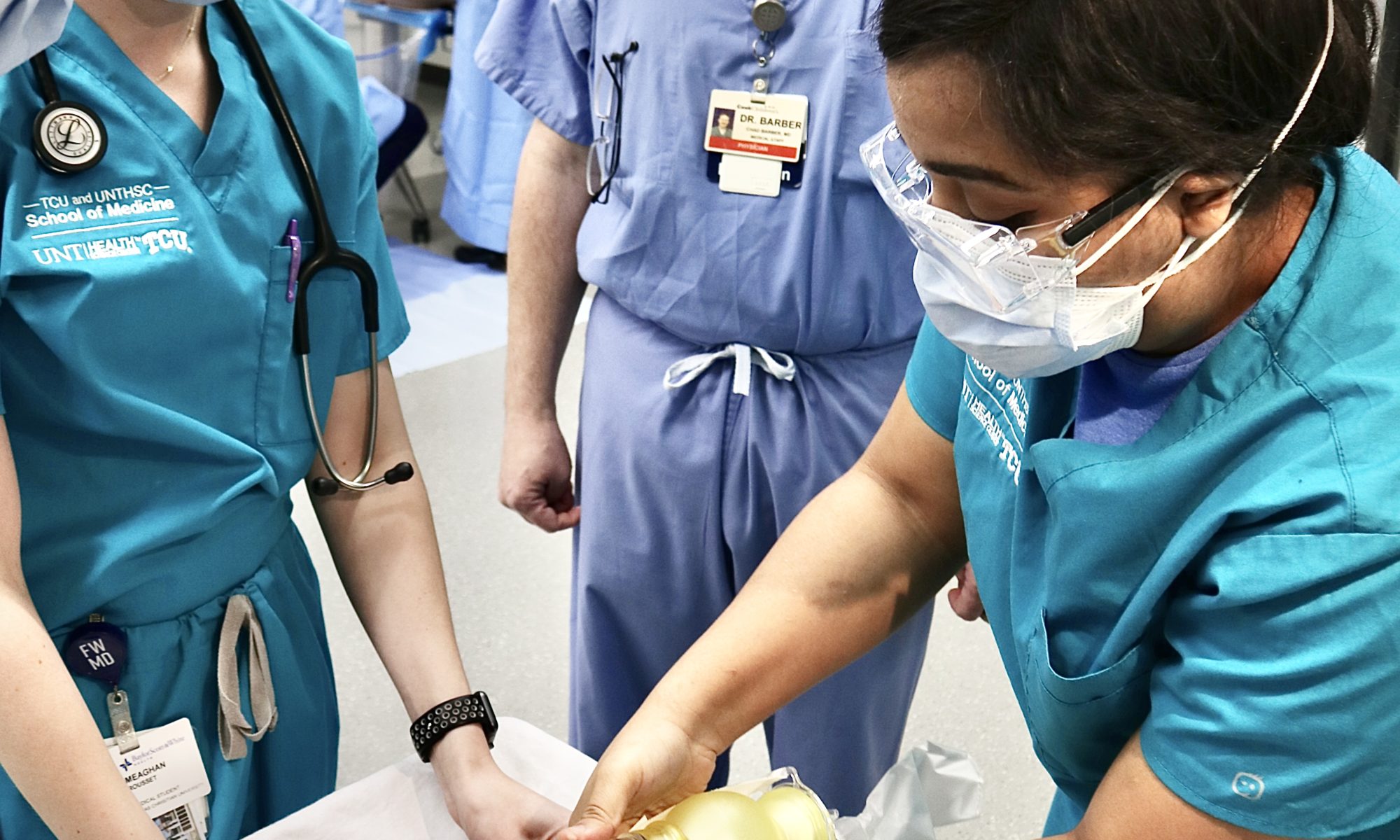 Charna Kinard (right), second-year medical student at TCU and UNTHSC School of Medicine, provides oxygen to a newborn mannikin during a child birthing simulation session on March 4, 2021.