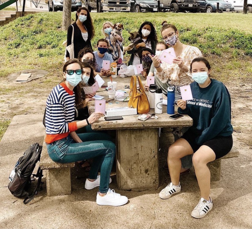 Medical student members of American Medical Women’s Association gather to work on the Purse Project.