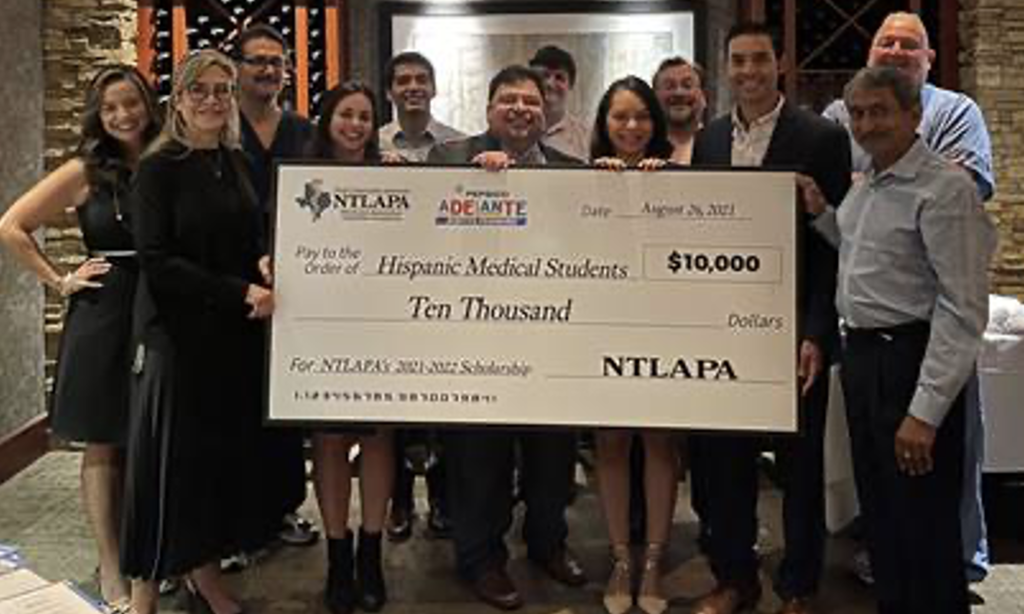 The North Texas Latin American Physicians Association (NTLAPA) awarded first-year medical student Isabella Amado, center left, a $10,000 scholarship.