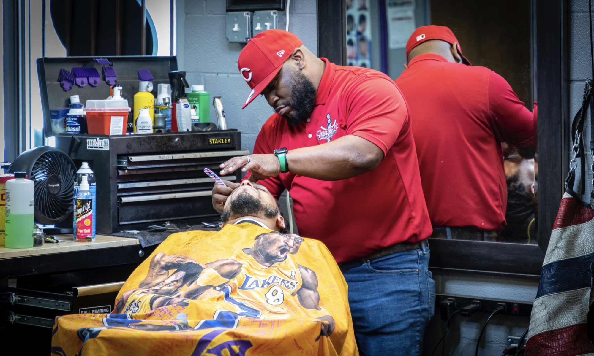 Lanter Goodrich, owner of House of Fades cutting hair, at his barbershop in Fort Worth in April.