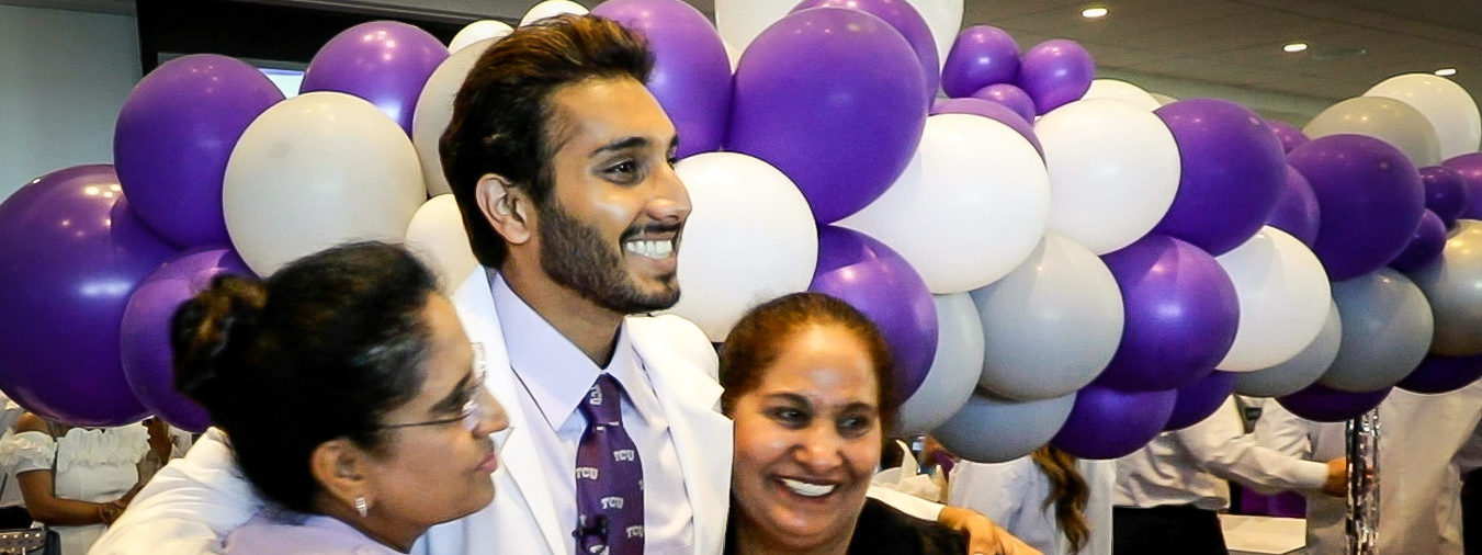 Parminde Deo, MS-1, with his family at the TCU School of Medicine White Coat Celebration at TCU Legends Club at Amon G. Carter Stadium in Fort Worth, Texas on Saturday, July 16.