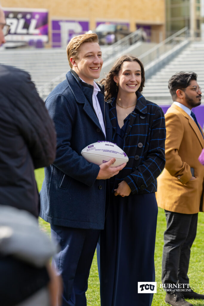 Jonas Kruse and his wife, Anabel, celebrate his residency match at UCLA in interventional radiology at Burnett School of Medicine's Match Day 2023 at Amon G. Carter Stadium at Texas Christian University in Fort Worth, Texas on Friday, March 17, 2023.