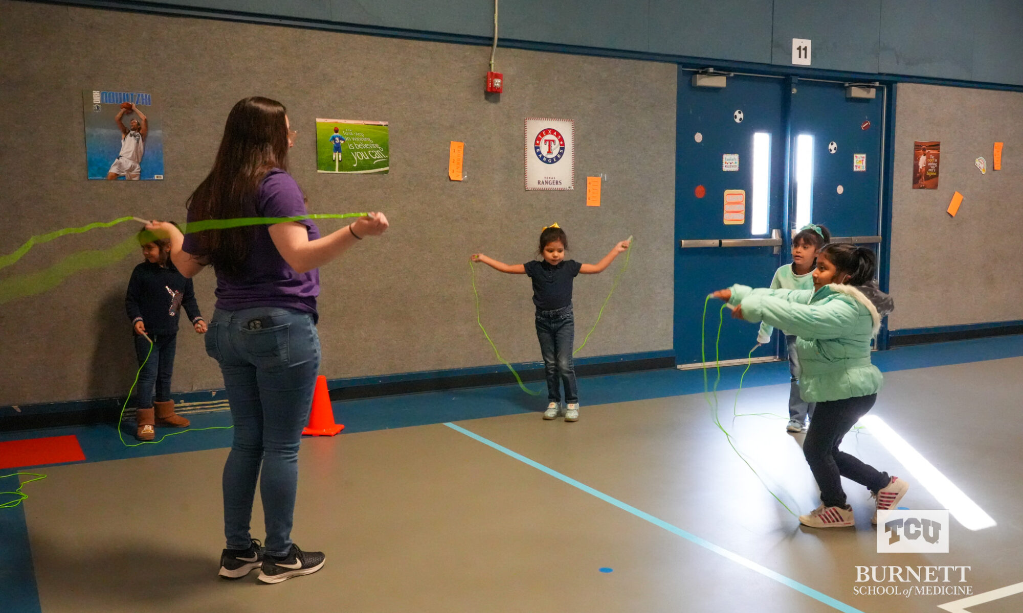 Anne Burnett Marion School of Medicine at Texas Christian University exercise and play with CC Moss Elementary students in Fort Worth.