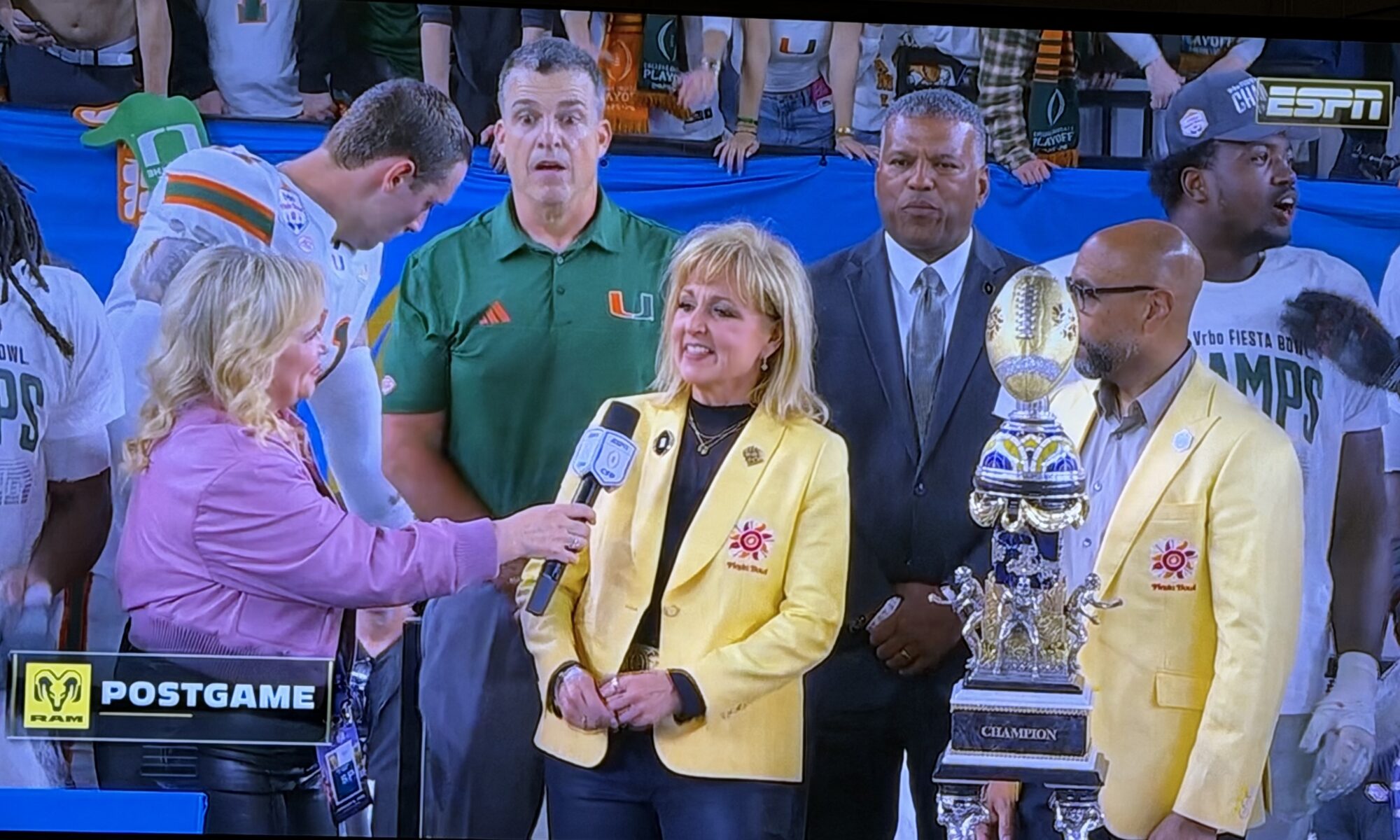 Judy Bernas, in yellow jacket, at Vrbo Fiesta Bowl