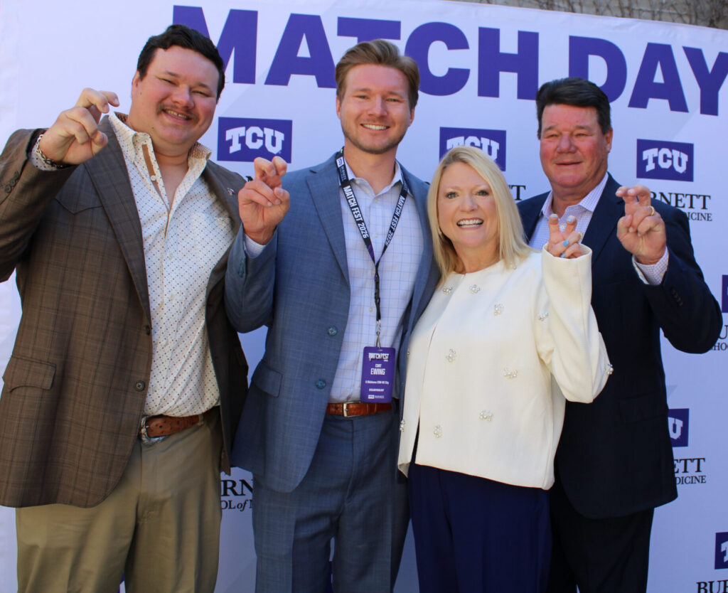 Cort Ewing, wearing lanyard, and his family celebrate on Match Day. 
